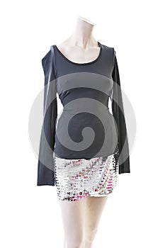 Party top black and silver with mini mirror skirt on mannequin full body shop display. Woman fashion styles, clothes on