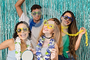 Partygoers are celebrating Carnival in Brazil. People in colorful and happy sunglasses.. photo