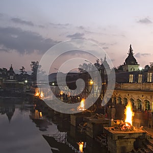Pashupatinath temple complex on Bagmati River in the evening. Funeral pyres. Kathmandu Valley, Nepal