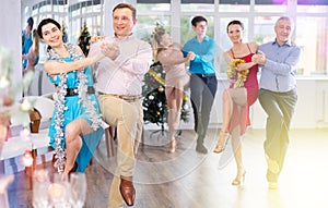 Paso doble dance during Christmas or New Year celebrations in dance studio photo