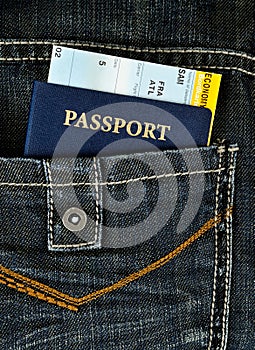 Pasport with boarding pass in jeans photo