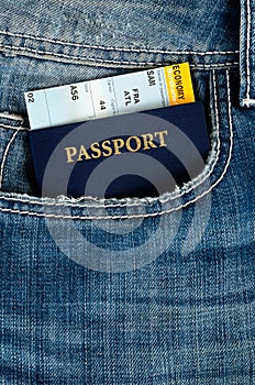 Pasport with boarding pass in jeans photo