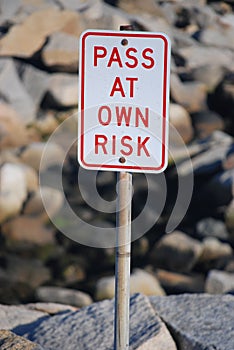 Pass at Own Risk Signage