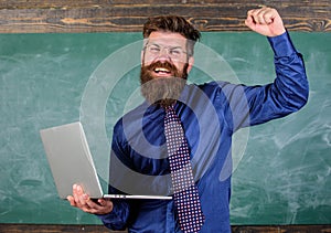 Pass test online. Distance education concept. Teacher bearded man with modern laptop passed test online chalkboard