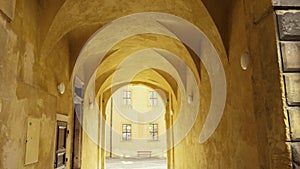 Passage with arcades leading through historic house, little alley