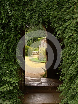 Passage through archway of old ruins