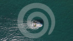 Passage of fishing boat viewed from above
