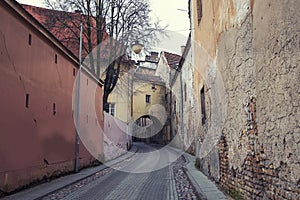 passage in the historical center of the old city of Vilnius Lithuania among the dilapidated brick walls of street of St. Casimir