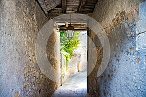 Passage in a narrow ancient street with wooden beams