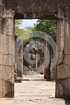 Passage in ruins to Buddha statue