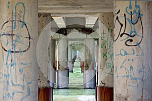 Passage in the sea, murales on pillars of jetty in Versilia (Viareggio) photo