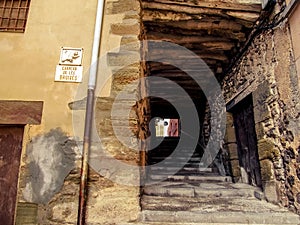 Passage with a staircase on the medieval street of the Witches Carrero de les Bruixes in Cervera town Catalonia, Spain. photo