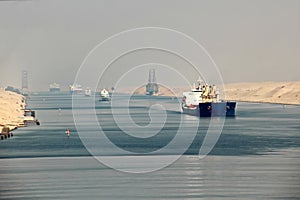 Passage through the Suez Canal by large sea vessels. photo