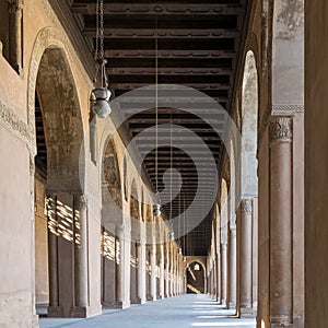 Passage surrounding the courtyard Ahmad Ibn Tulun Mosque with huge decorated arches, Cairo, Egypt