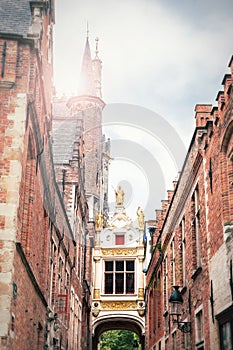 Passage to the Burg square in Bruges between the town hall on th