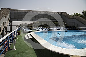 Passage of a tourist cruise through the lock of the Nile River at the height of the city of Esna in Egypt, Africa.