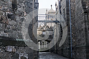 Passage between the walls of an old castle that looks like a medieval street