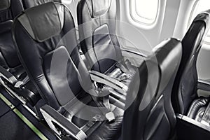 Passanger seats in salon of passenger airplane jet