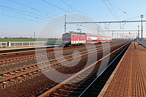 Passanger train station with train photo