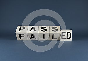 Passed or Failed. Cubes form the choice words Passed or Failed