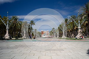 Passeig de Lluis Companys promenade in Barcelona with cloudy sky above