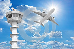 Passenger aircraft flying above air traffic control tower agai