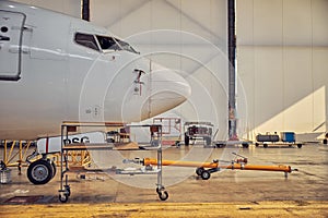 Passenger aircraft in the hangar on the service