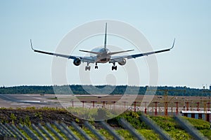 Passenger aircraft landing on the airport during daytime