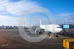 Passenger aircraft is ready for departure terminal by day flight, gangway waiting for to disconnect