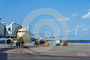 Passenger aircraft is ready for departure terminal by day flight, gangway waiting for to disconnect