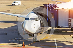 Passenger aircraft is ready for departure terminal by day flight, gangway waiting for to disconnect