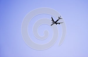 Passenger airplane against clear blue sky, traveler