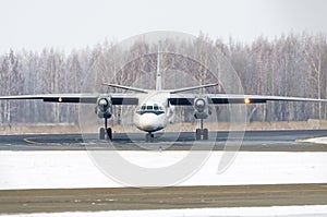 Passenger Airplane on the airfield winter before takeoff.
