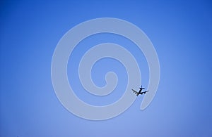 Passenger airplane fly against clear blue sky