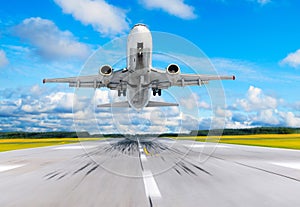 Passenger airplane fly up over take off runway from airport.