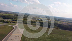 Passenger airplane is gaining speed on the runway and takes off.