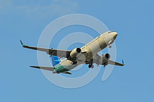 Passenger airplane landing at the airport