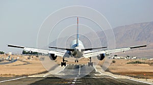 Passenger airplane landing on runway. photo