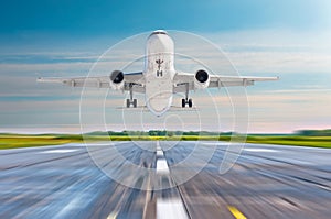 Passenger airplane landing on a runway airport.