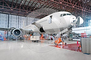 Passenger airplane on maintenance of engine and fuselage repair