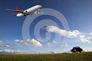 Passenger airplane over farmland