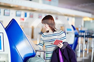 Passenger at the airport, doing self check-in