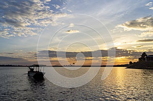 Passenger boats across the side of the dam. Evening atmosphere along the water in the dam