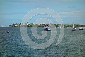 passenger boats anchored in the bay of Porto Seguro, Bahia, Brazil