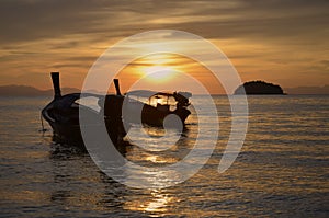 Passenger boats in scintillation sea in the evening photo