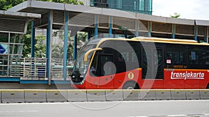 Passenger buses arrive at the bus stop on Letjend Suprapto street. Cempaka Mas, East Jakarta.