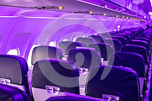 Passenger cabin of an empty plane. Economy class seats, blurred background. The flight is waiting for passengers to