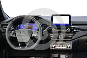 Passenger car dashboard with steering wheel, instrument panel and infotainment display
