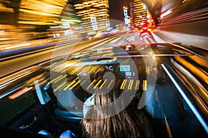 Passenger car driving through a city