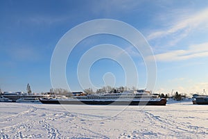Passenger and cargo ships in frozen river